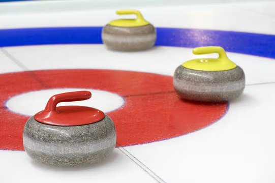 Curling stones on ice